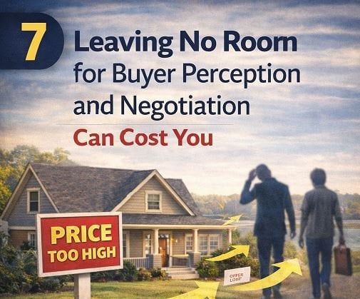 For sale sign with price reduction